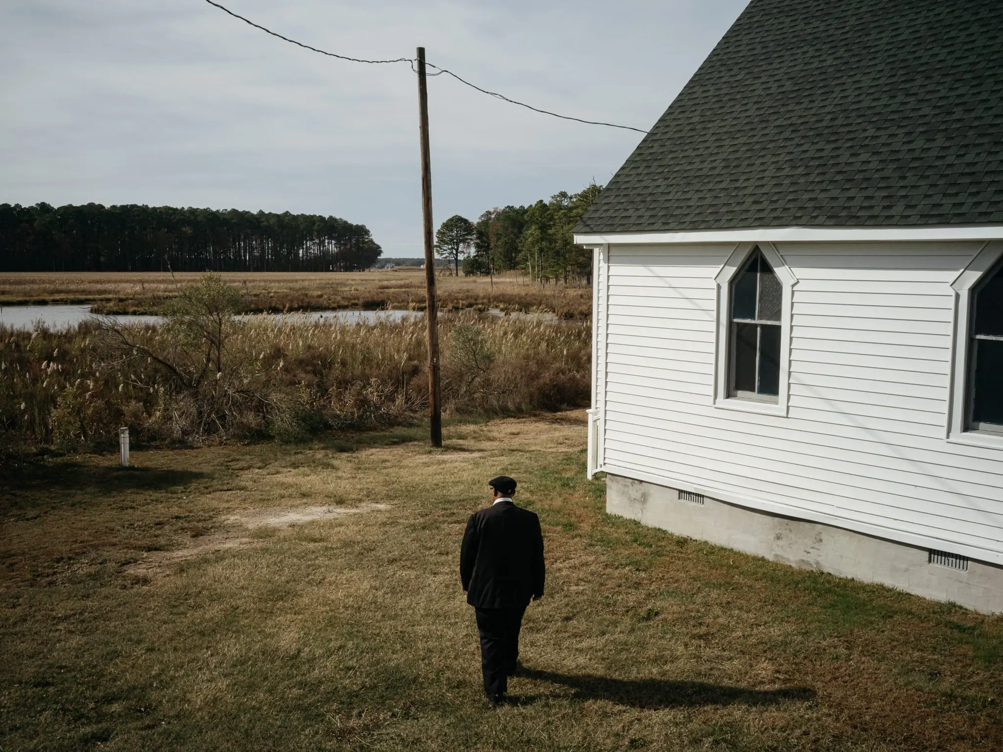 Douglas walks to the rear entrance of New Revived United Methodist Church in Taylor's Island, Md.