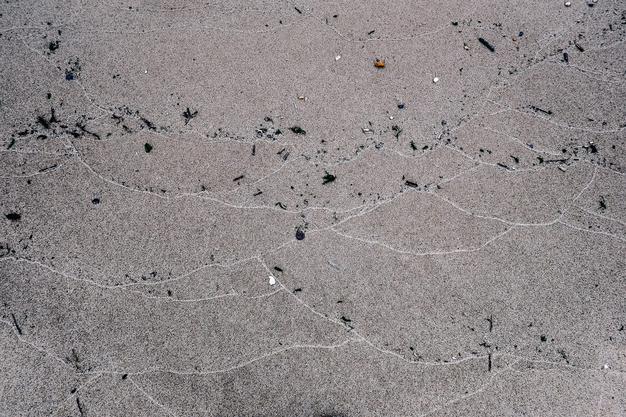 Tide lines in the sand show how far the water comes at Kent Island.