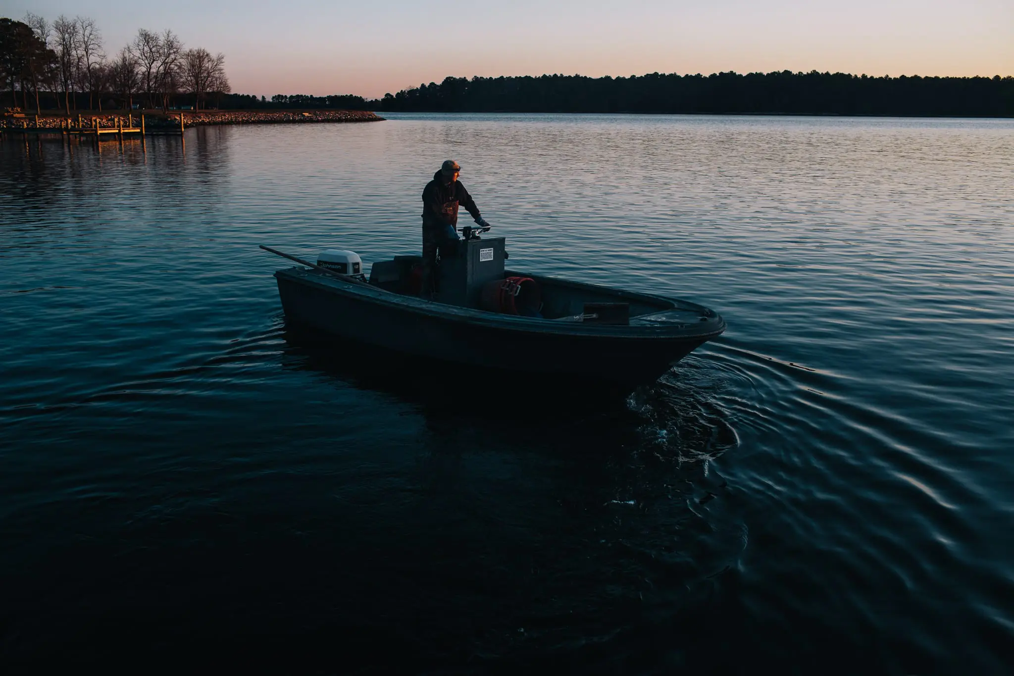A waterman pulls his boat out at dawn near Bozman.