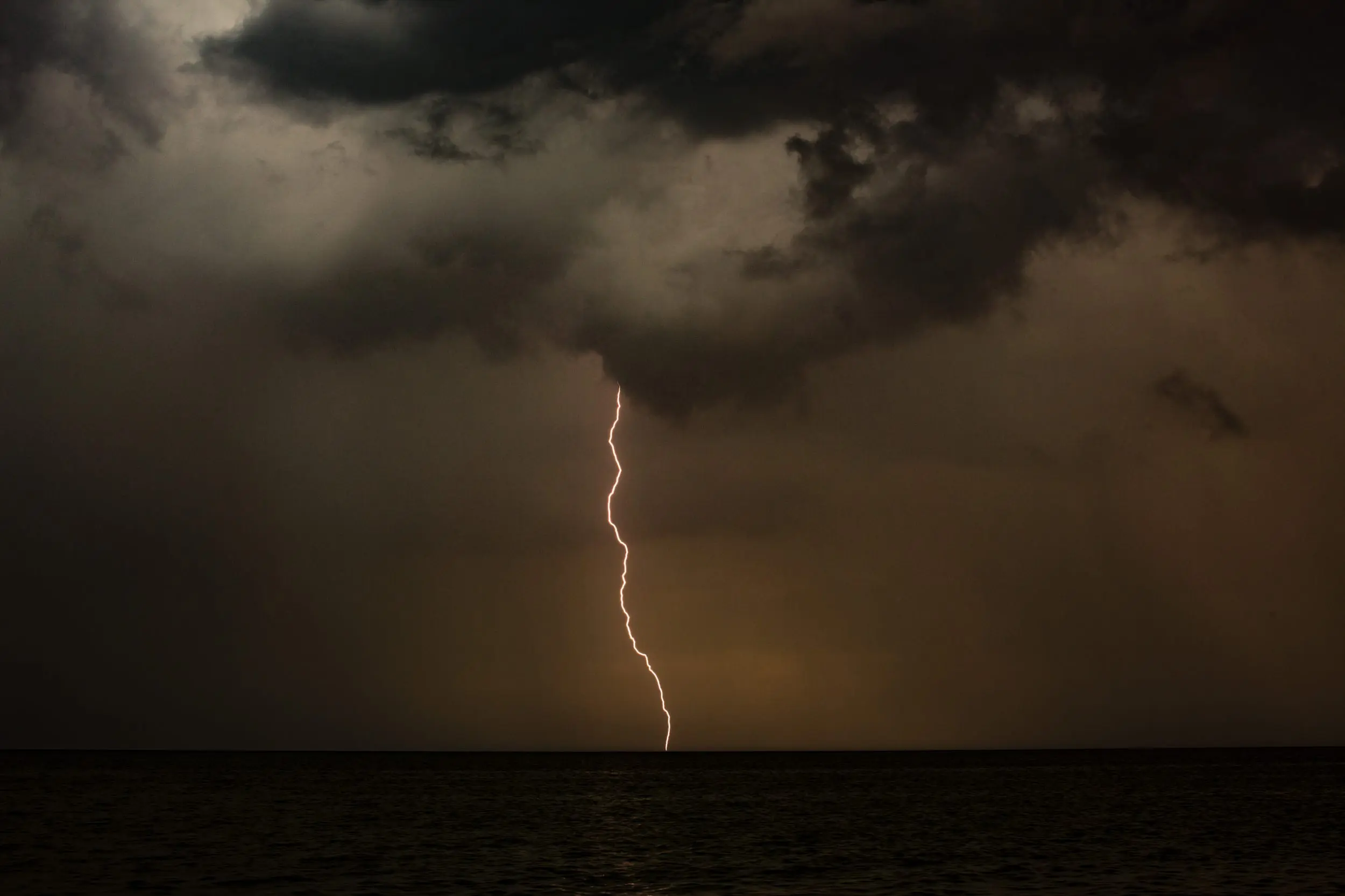 Lightning strikes the Chesapeake Bay as a storm rolls in from the West.