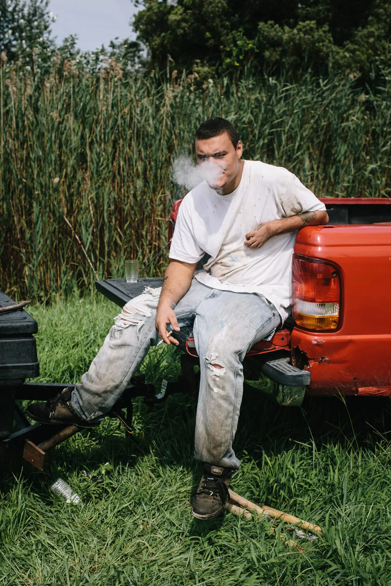 Bruce Strobel takes a break from clearing fallen trees.