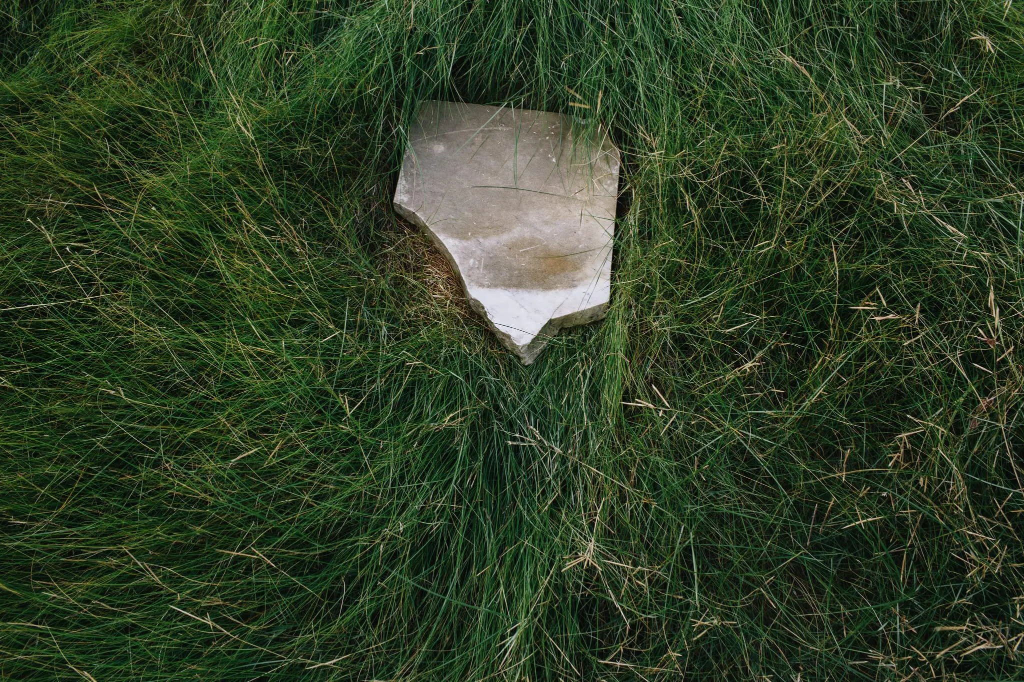 A broken headstone at a grave site on Hooper Island.