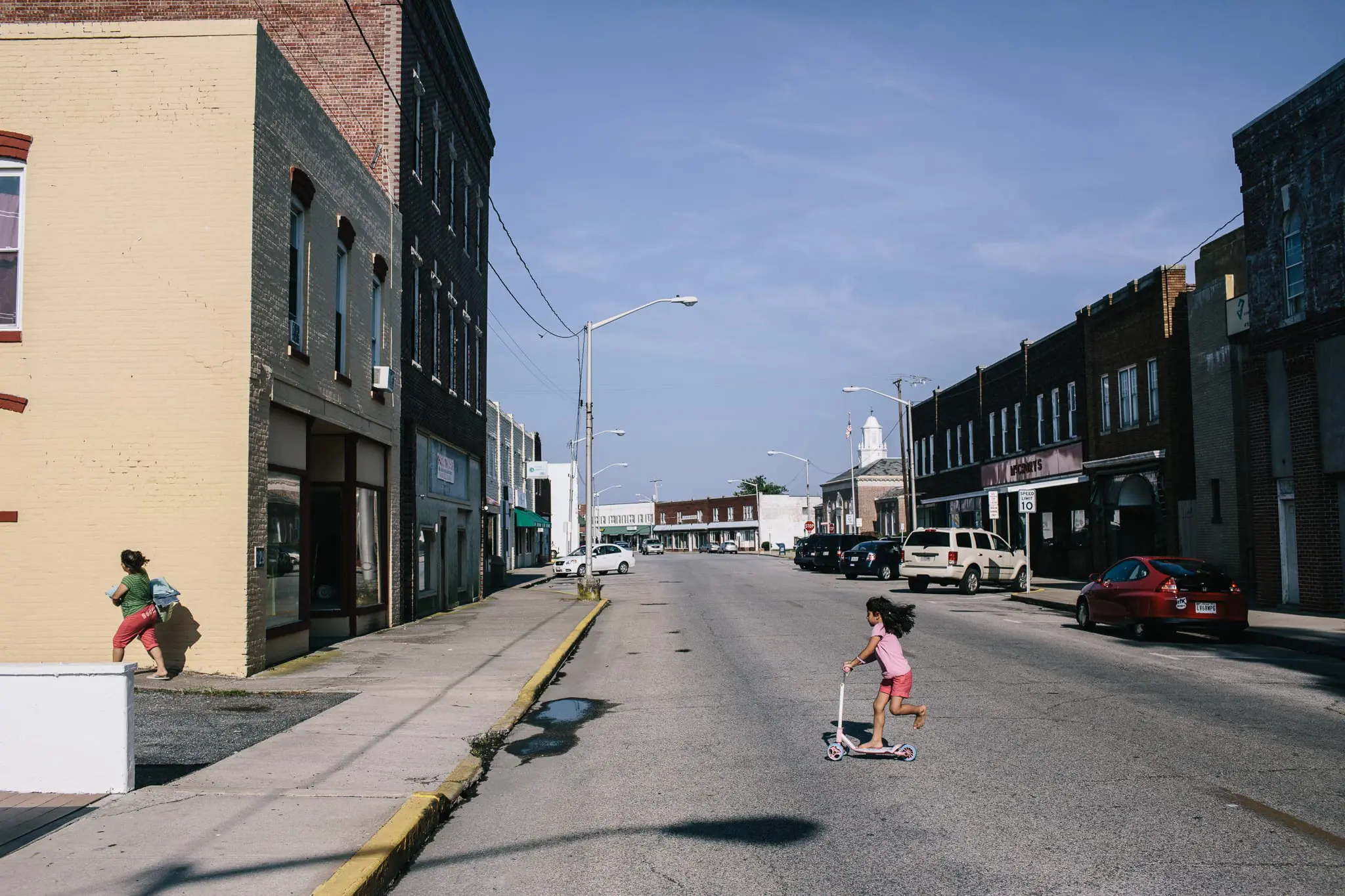 Vanessa Hernandez, 5, plays on Crisfield's Main Street.