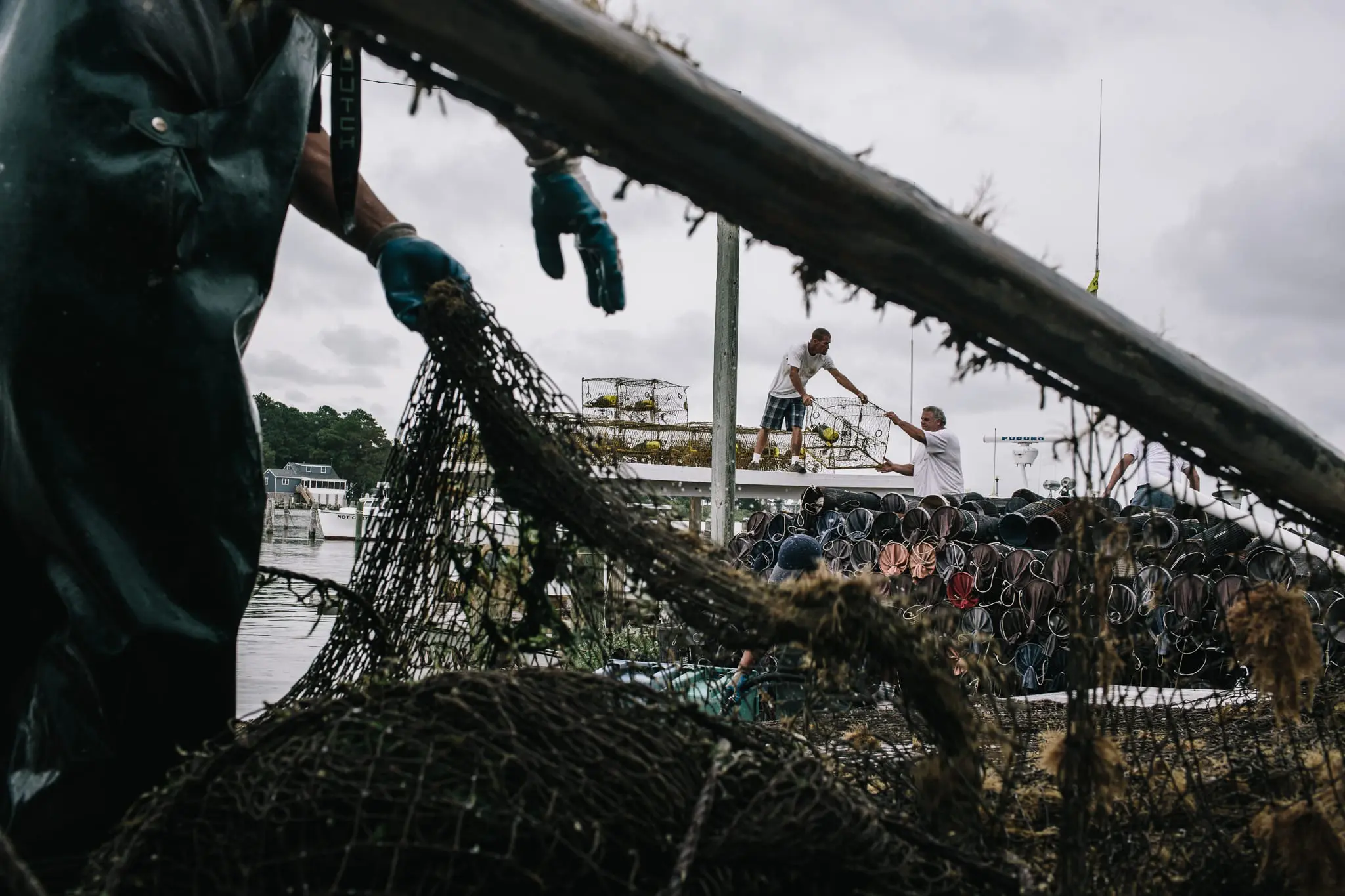 Watermen clean crab pots and nets in Fishing Creek.