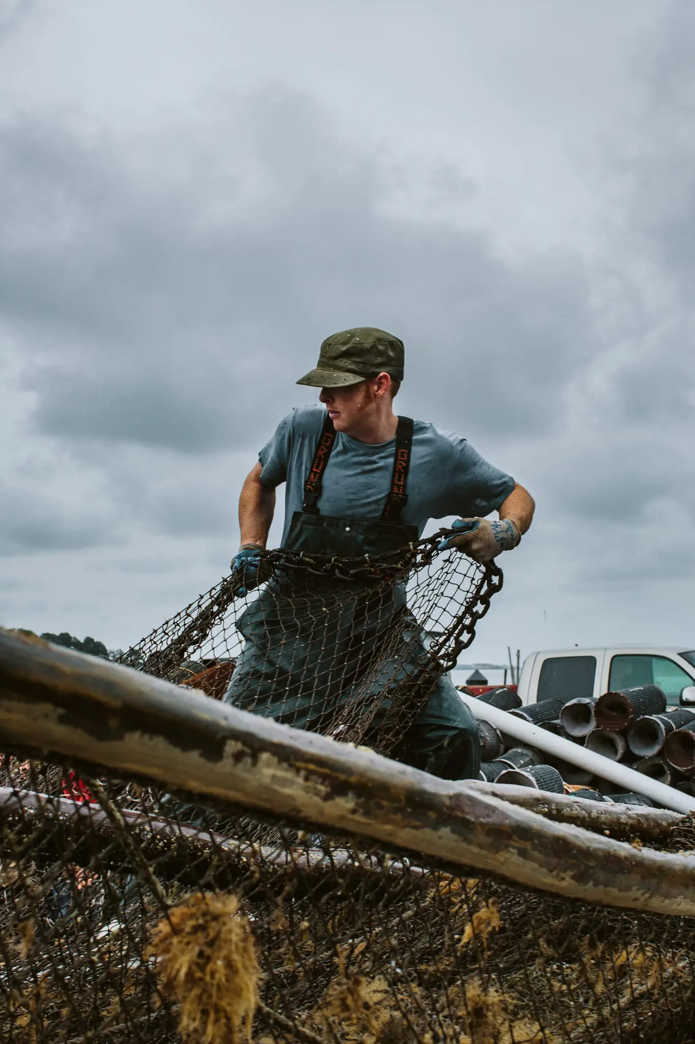 Waterman Aaron Powley hauls in a net in Fishing Creek.