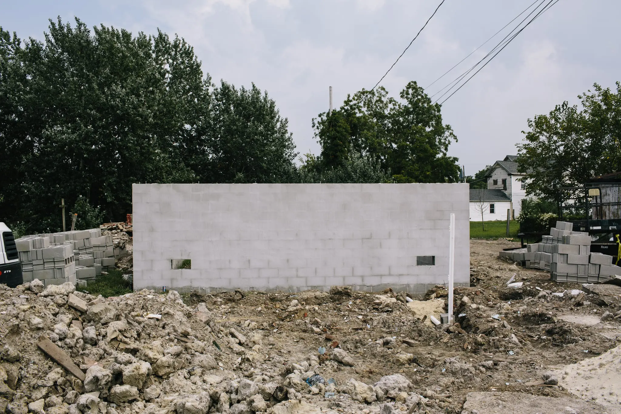 The foundation of a new home stands more than 15-feet high.