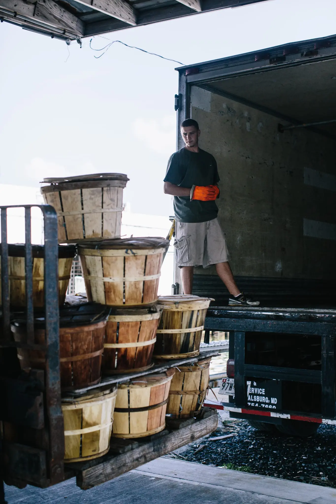 Mike Tyler helps load buckets of crabs.