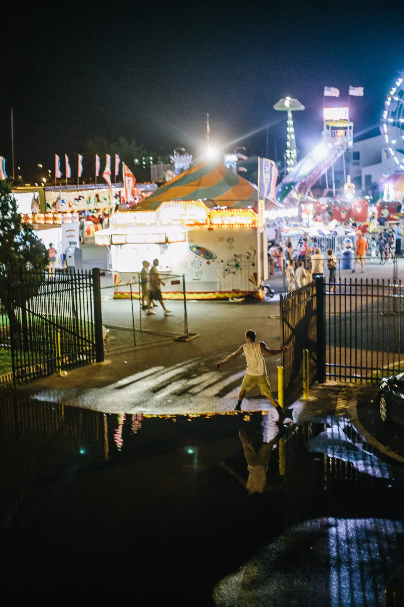 Sea water from high tide pushes through drains at the Labor Day fair.
