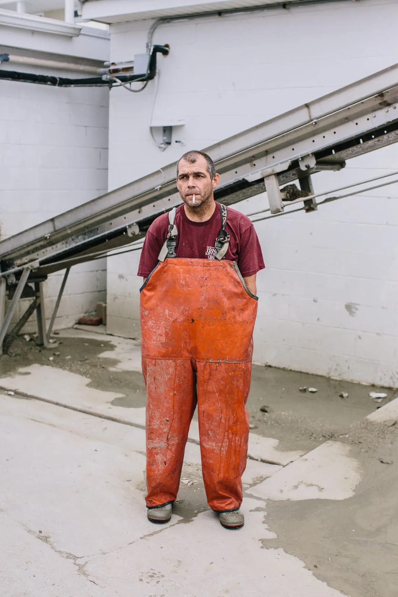 Don Wharton takes a smoke break while shucking oysters at MeTompkin Seafood.
