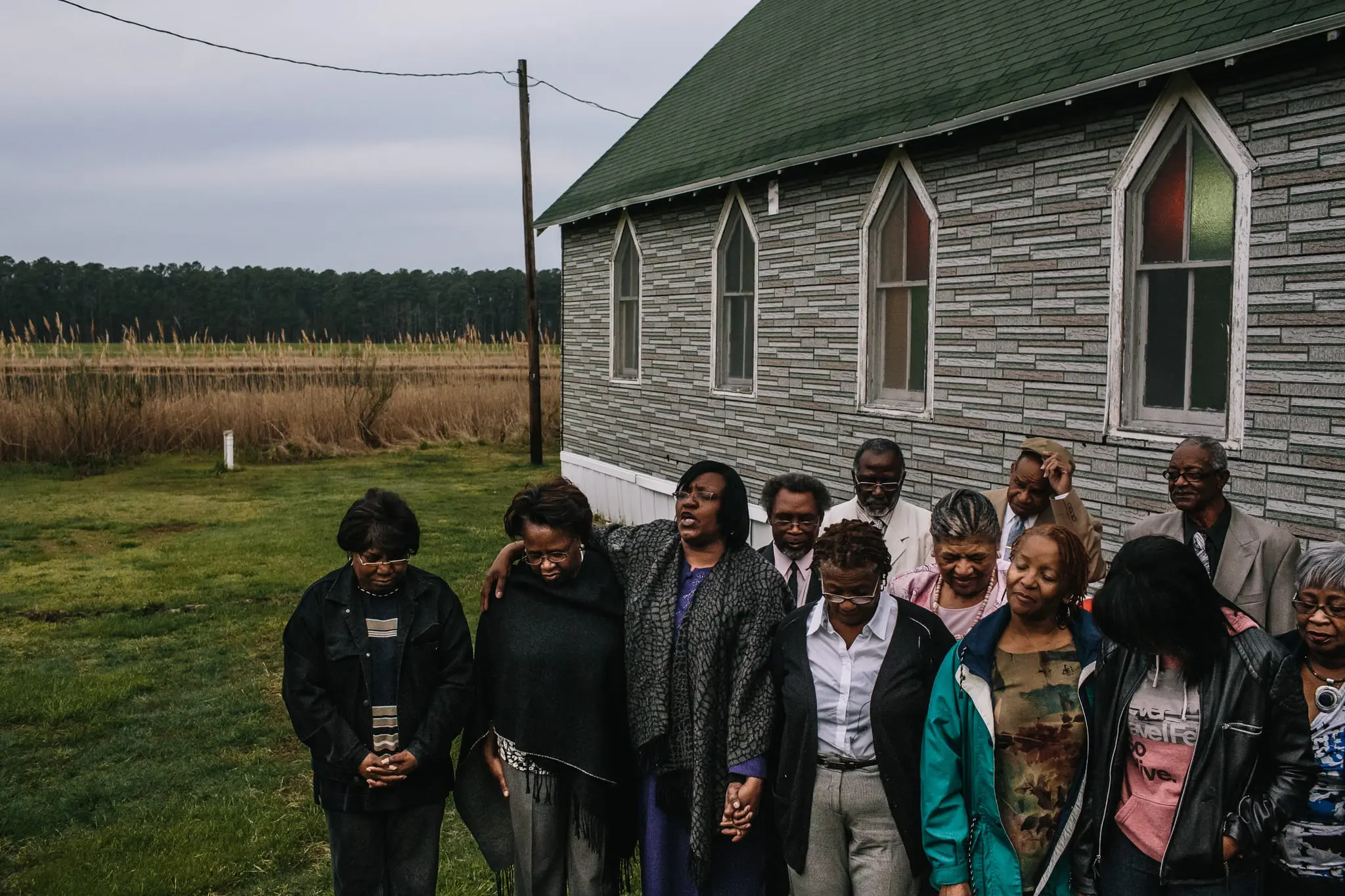 Members of the New Revived Methodist Church in Madison, Md pray outside during the sunrise service on Easter morning.