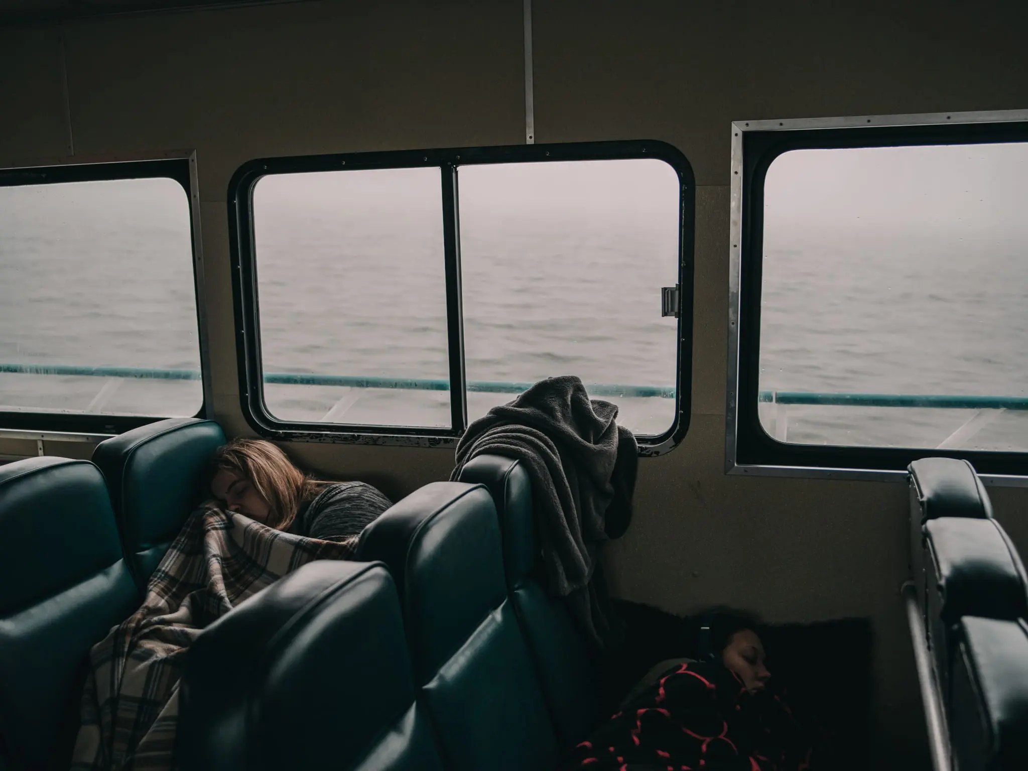 Students sleep on the ferry from Smith Island to Crisfield.